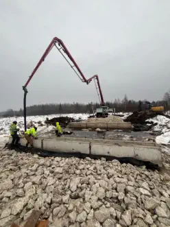 Pumping concrete in the winter during the Timber Bridge Construction
