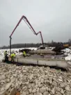 Pumping concrete in the winter during the Timber Bridge Construction